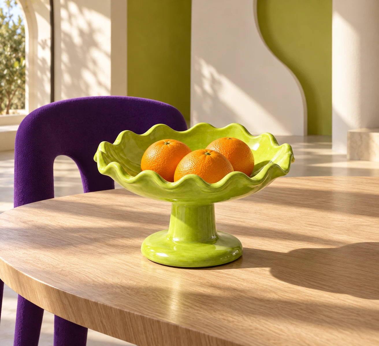 Sculptural pedestal bowl displayed in a bold modern dining space